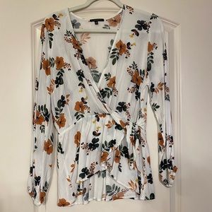 Faux wrap floral top size medium. Made by Staccato